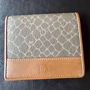 NINA RICCI bifold leather wallet featuring a distinct two-tone brown design-EUC